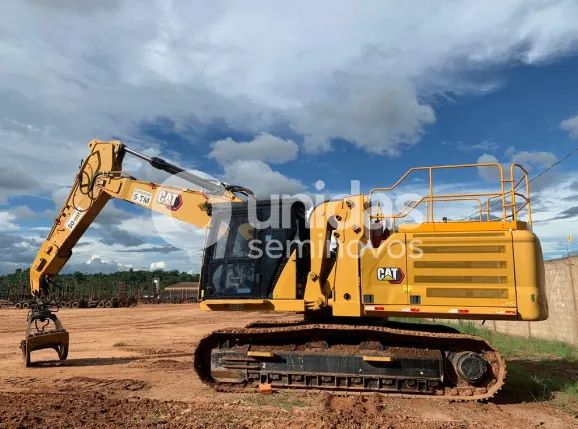 escavadeira florestal caterpillar 336 com garra florestal e cabine pantográfica