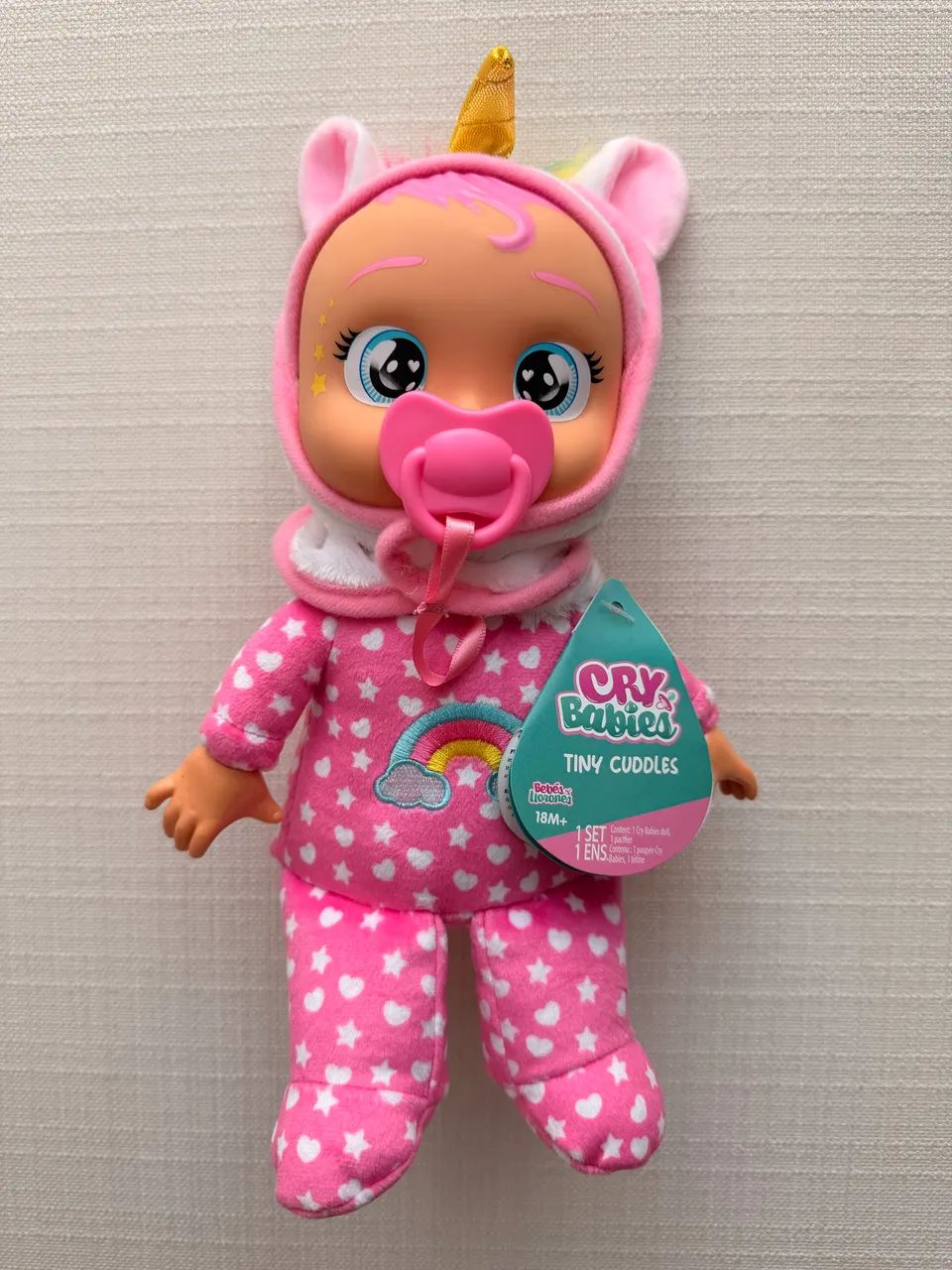 Boneca cry babies tiny cuddles unicórnio com chupeta  - Foto 4