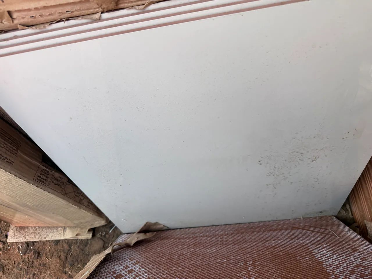 New beige polished floor tile in box