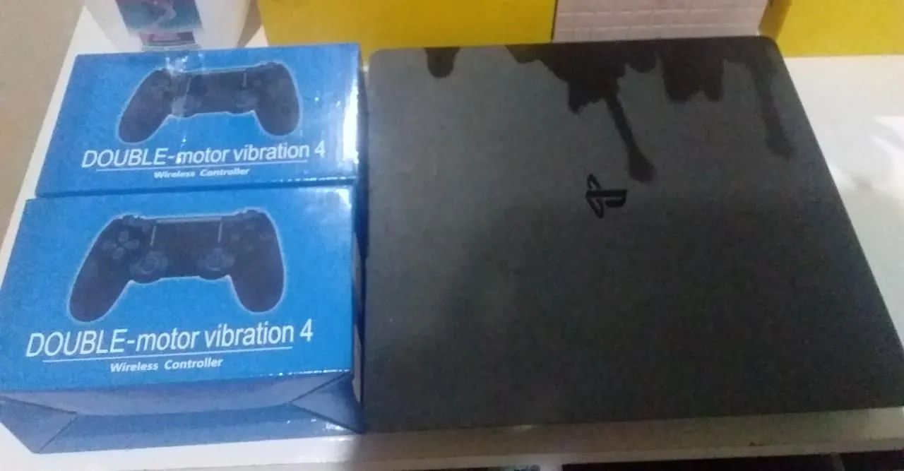 PS4 slim + dois controles novos na caixa+ vários jogos mídia digital na conta