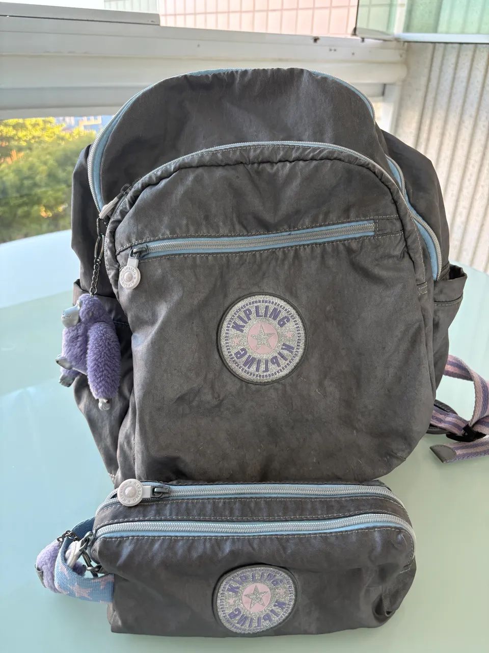 Mochila e estojo kippling