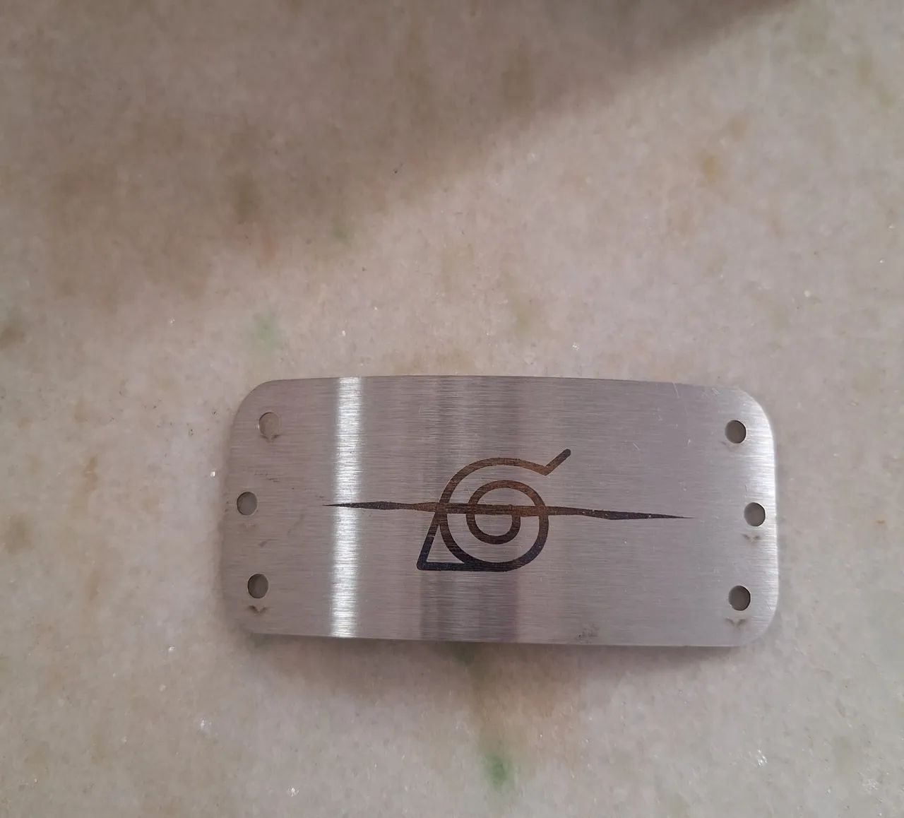 Chapinha de metal do Naruto 