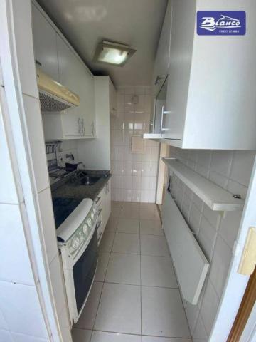 Apartamento com 2 dormitórios para alugar, 50 m² por R$ 900,00/mês - Vila Augusta - Guarul - Foto 4