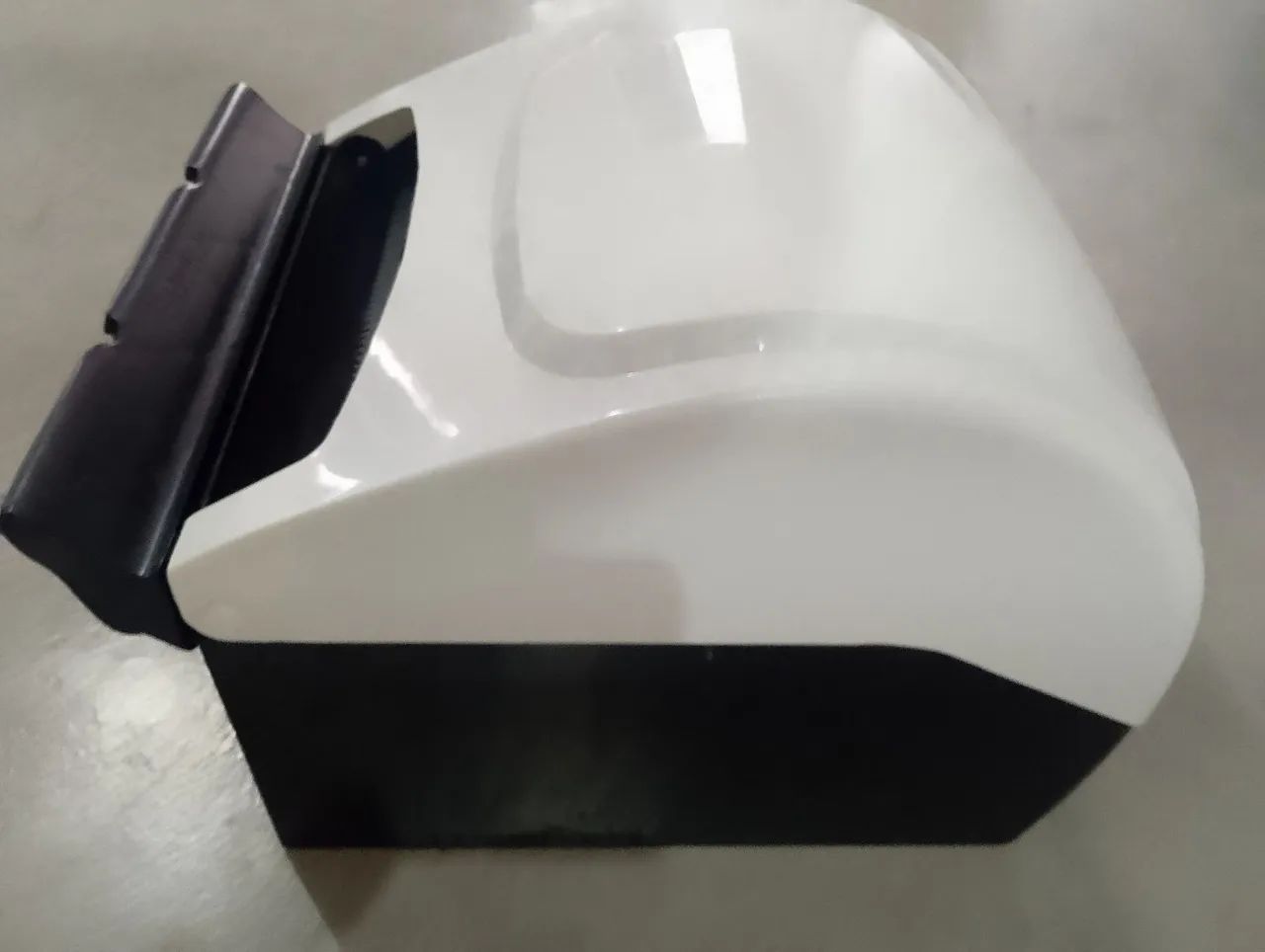 Paper towel dispenser with lever. White/black
