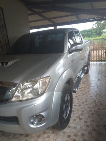 Vendo essa hilux pego carro de menor valor no negocio - Foto 4