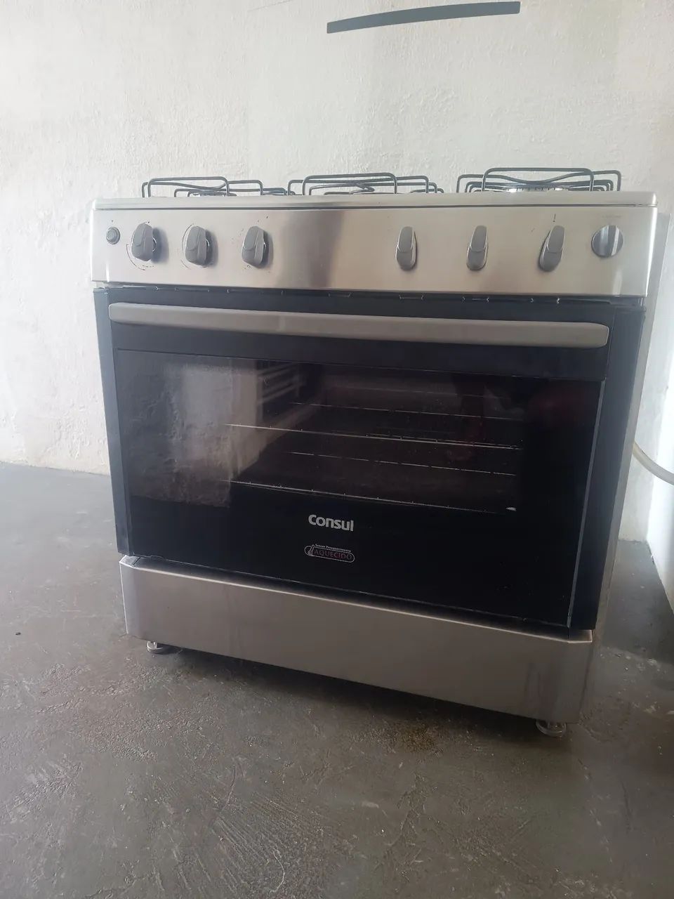 Fogão usado acendendo manual 