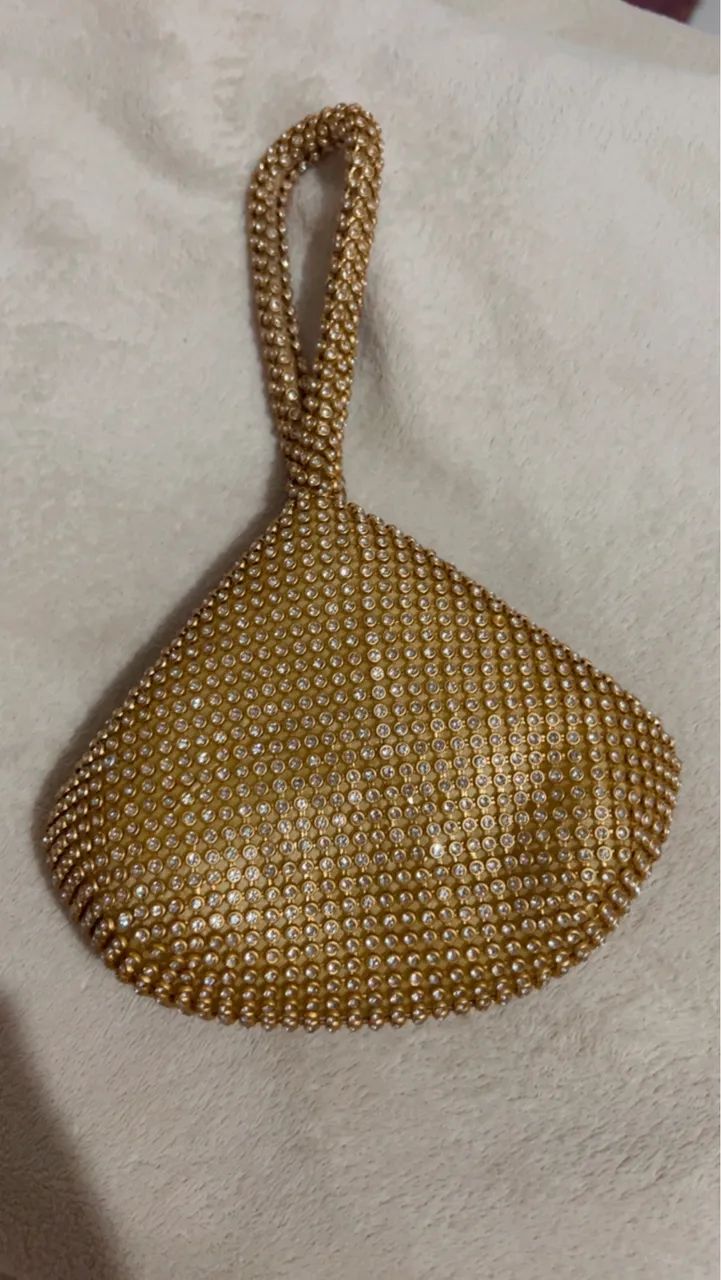 Bolsa de mão brilhosa dourada 