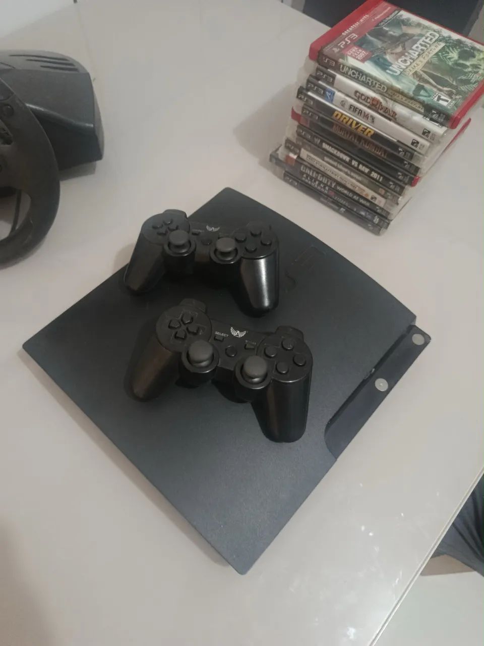 PS3 SLIM COM VOLANTE - Foto 2