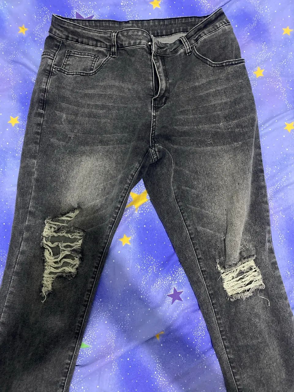 calça jeans preta rasgada tamanho m