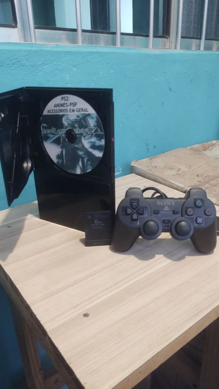 PS2 slim funcionando perfeitamente com memóricard e um controle e um jogo
