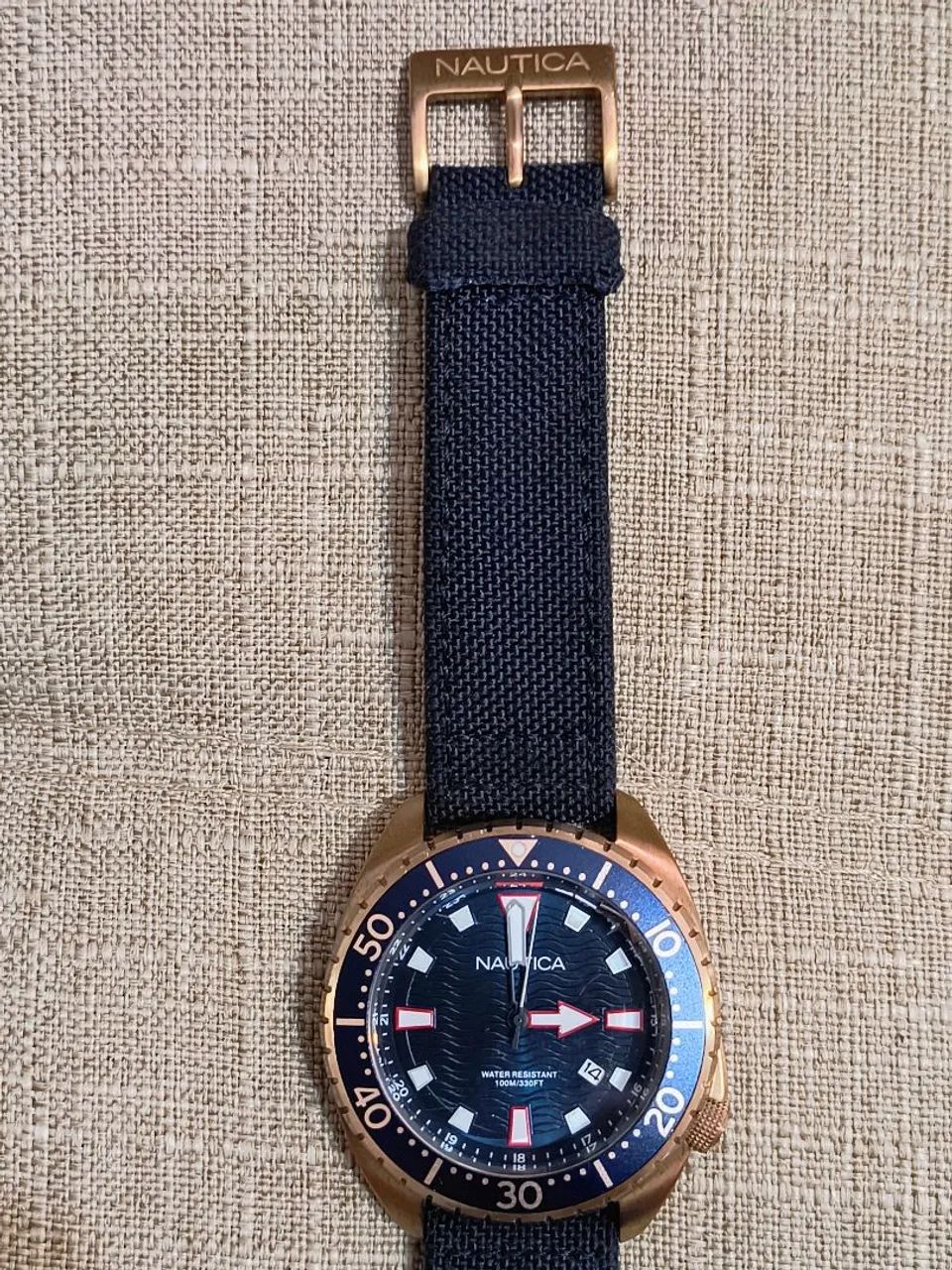 Relógio Nautica dourado fundo azul, pulseira nylon/couro.<br><br> - Foto 3