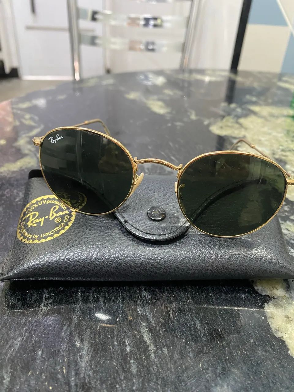 óculos de sol rayban round metal legend dourado