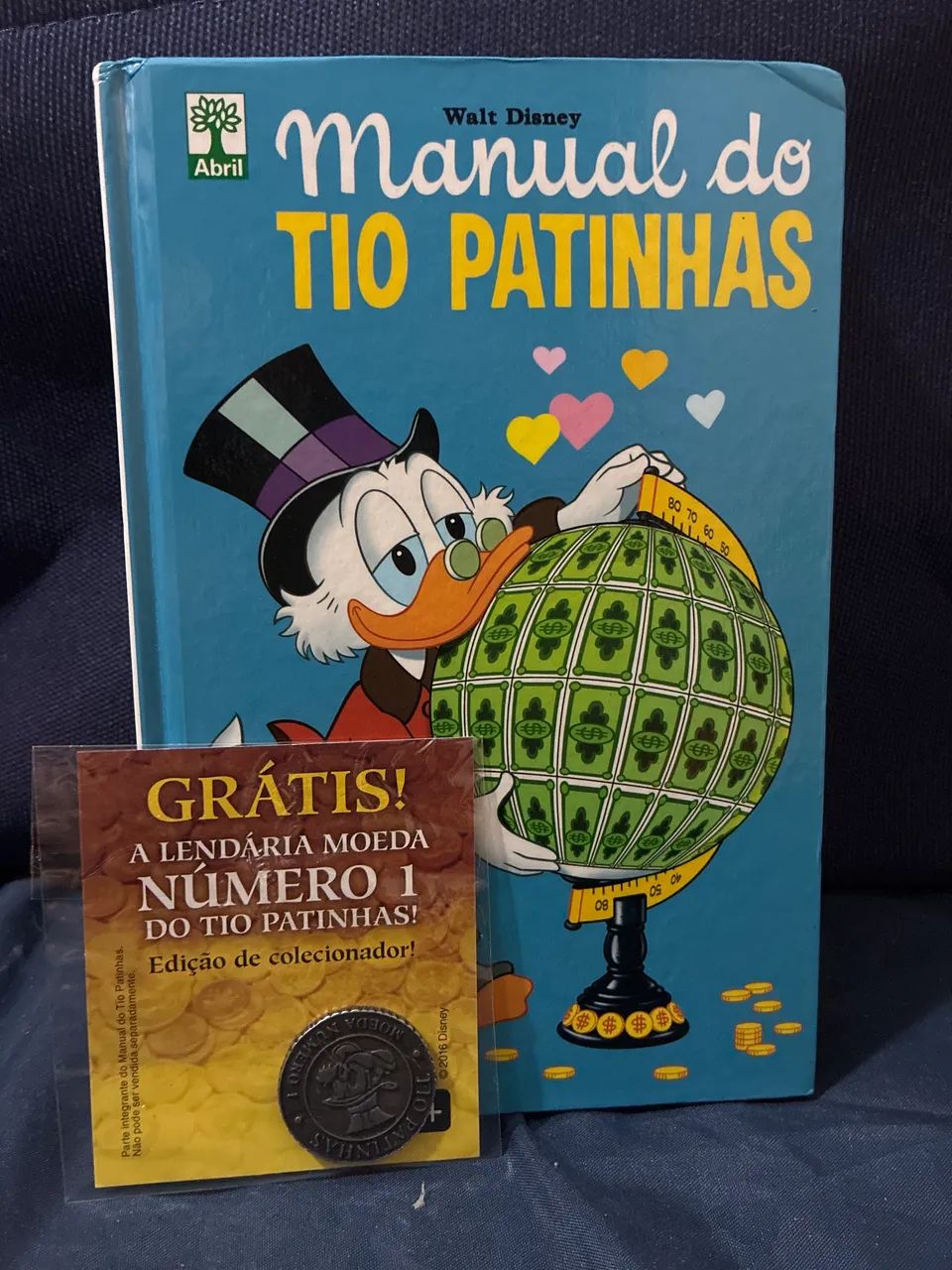 Manual do Tio Patinhas com moeda n°1