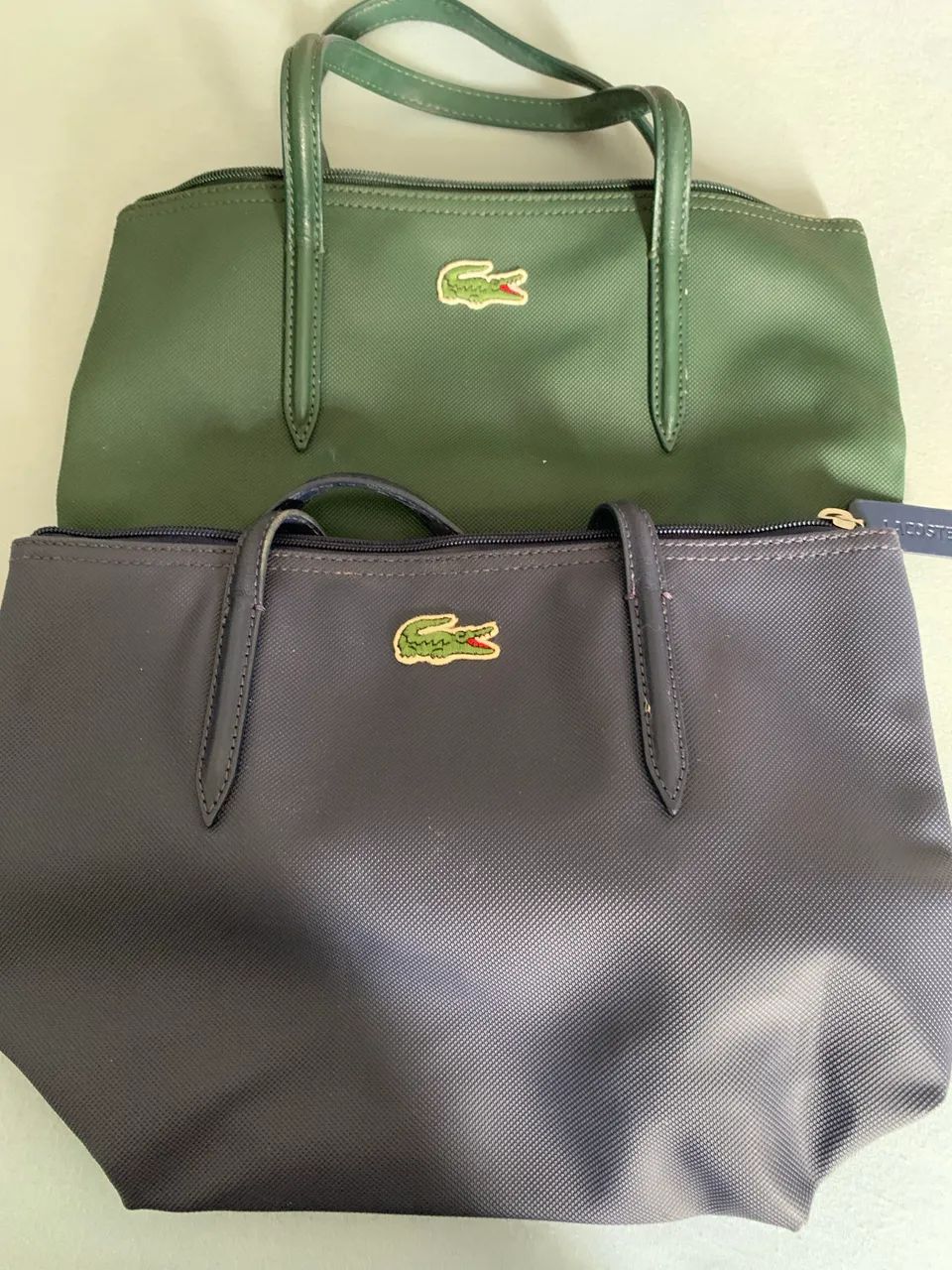 Bolsas Lacoste diversas cores e tamanhos 