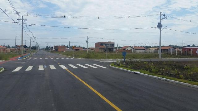 Terreno com pequena entrada, loteamento todo asfaltado - Foto 8