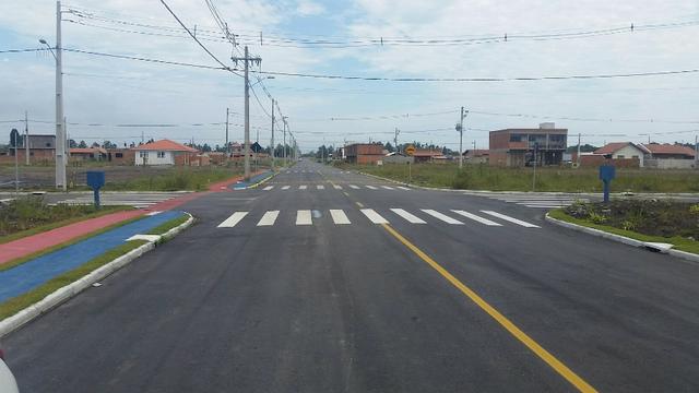 Terreno com pequena entrada, loteamento todo asfaltado - Foto 9