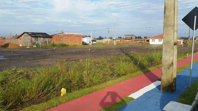 Terreno com pequena entrada, loteamento todo asfaltado - Foto 5