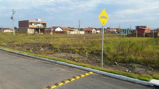 Terreno com pequena entrada, loteamento todo asfaltado - Foto 6