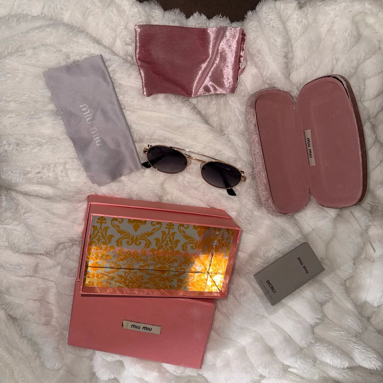 Óculos de sol MIU MIU