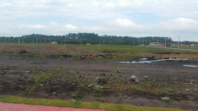 Terreno com pequena entrada, loteamento todo asfaltado - Foto 11