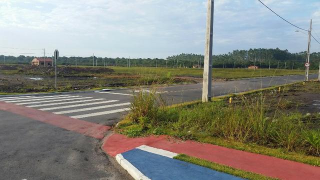 Terreno com pequena entrada, loteamento todo asfaltado - Foto 4