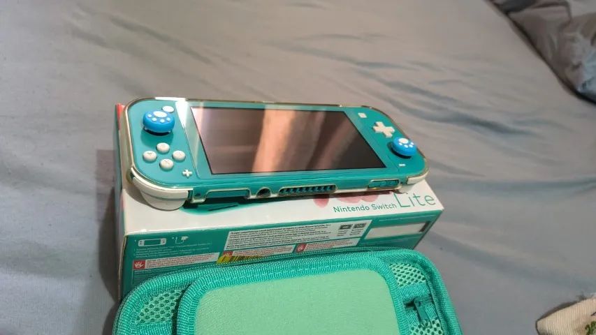 Nintendo Switch Lite Turquesa usado BLOQUEADO - Foto 5