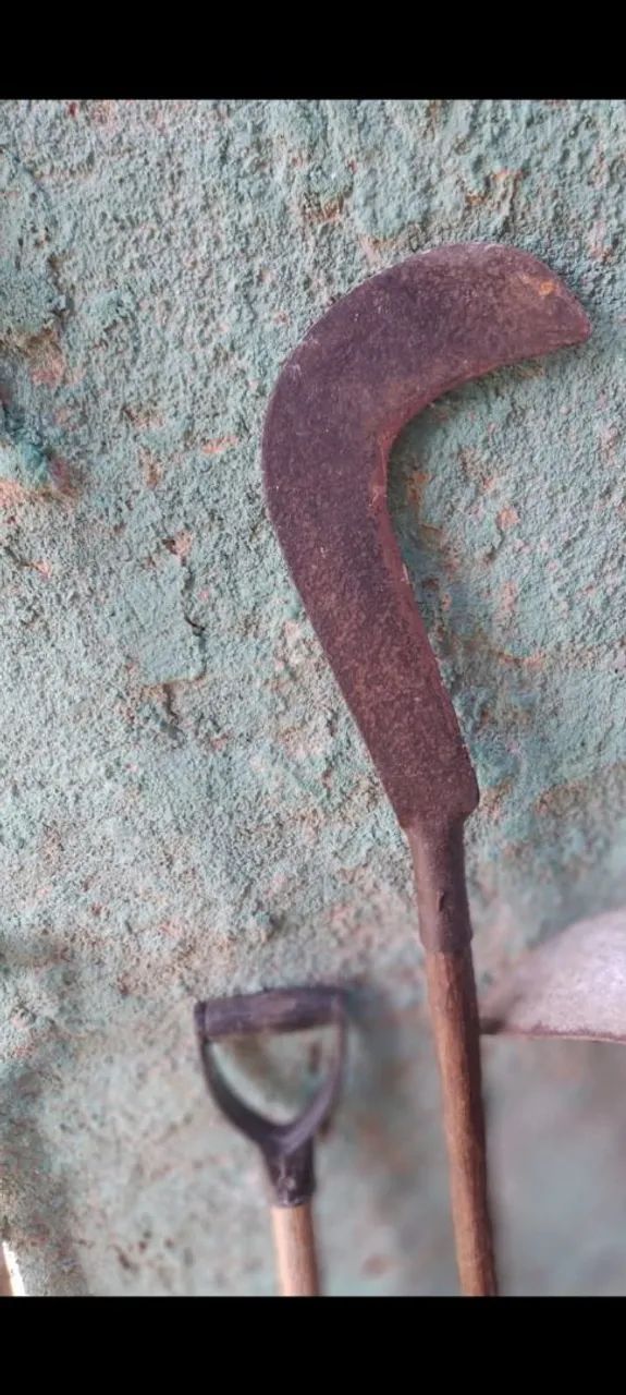 Selling a sickle with a wooden handle