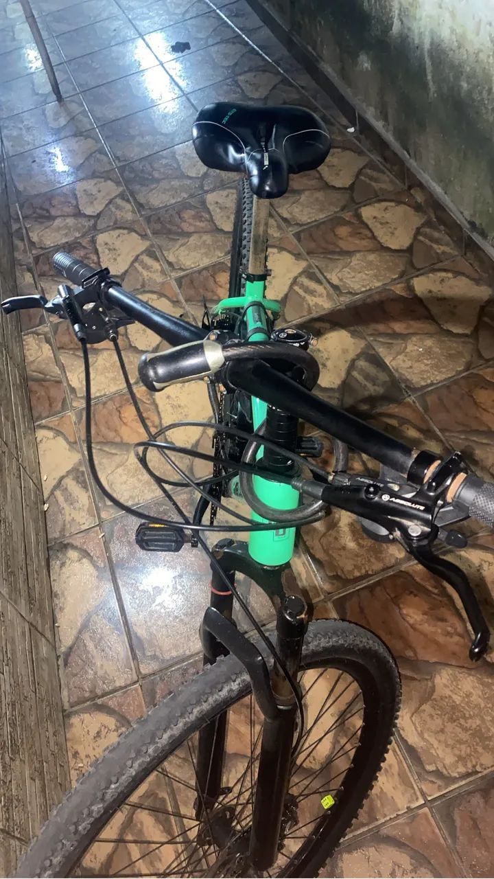 Bicicleta aro 29 cor verde freio a óleo 