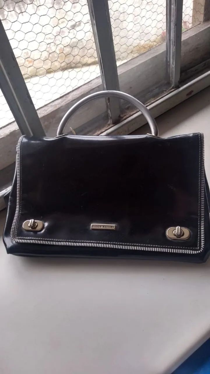 Bolsa cluth Gilson Martins 