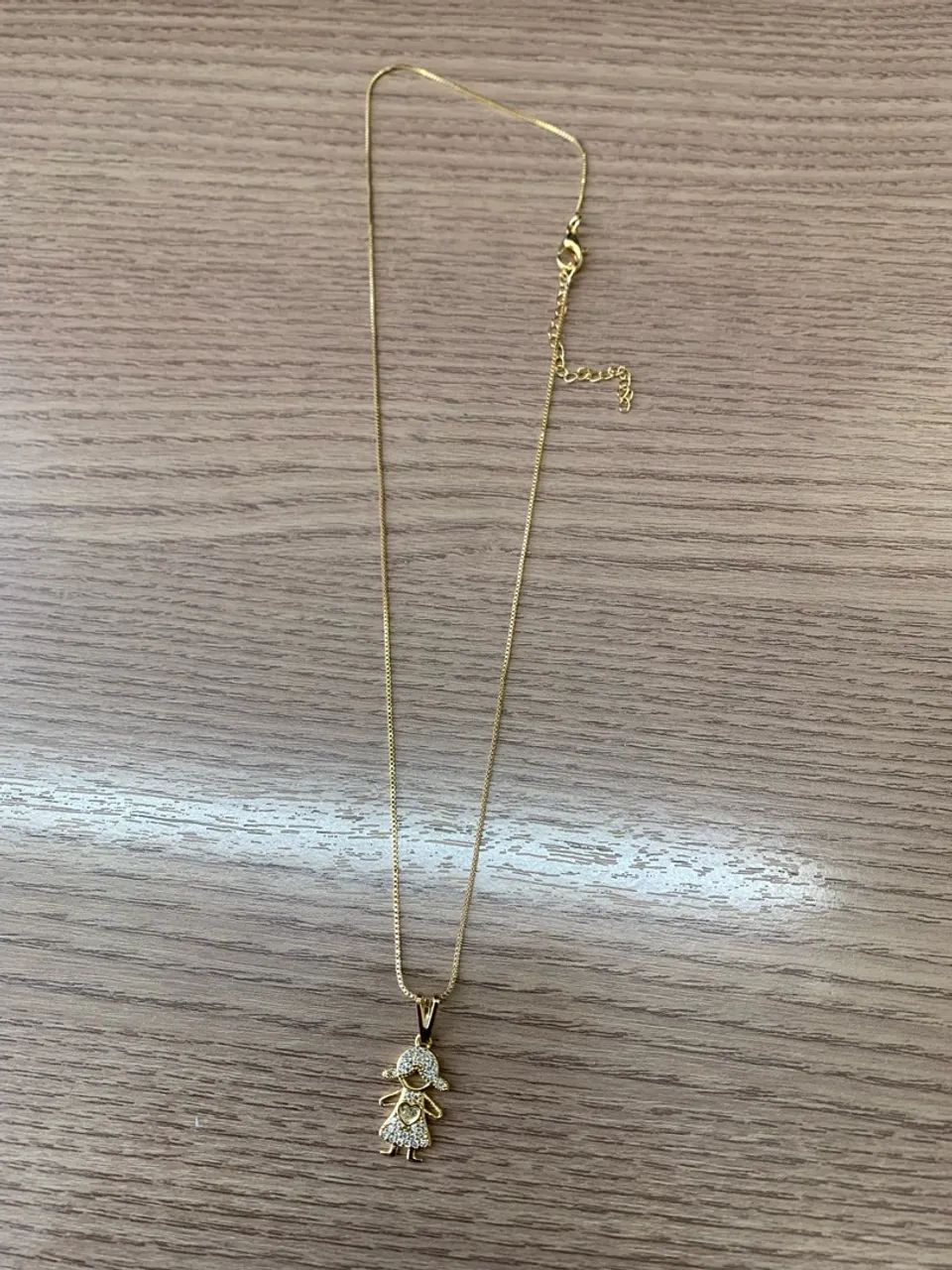 Corrente com temas de filhos folhada a ouro  - Foto 5