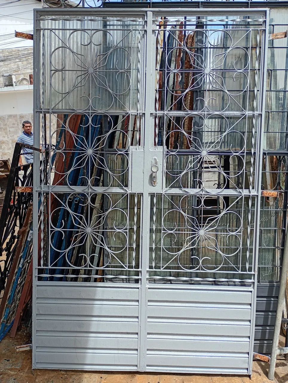 Double-leaf iron door, width 1.30 m, height 2.10 m, price $700 — just call *71 or WhatsApp