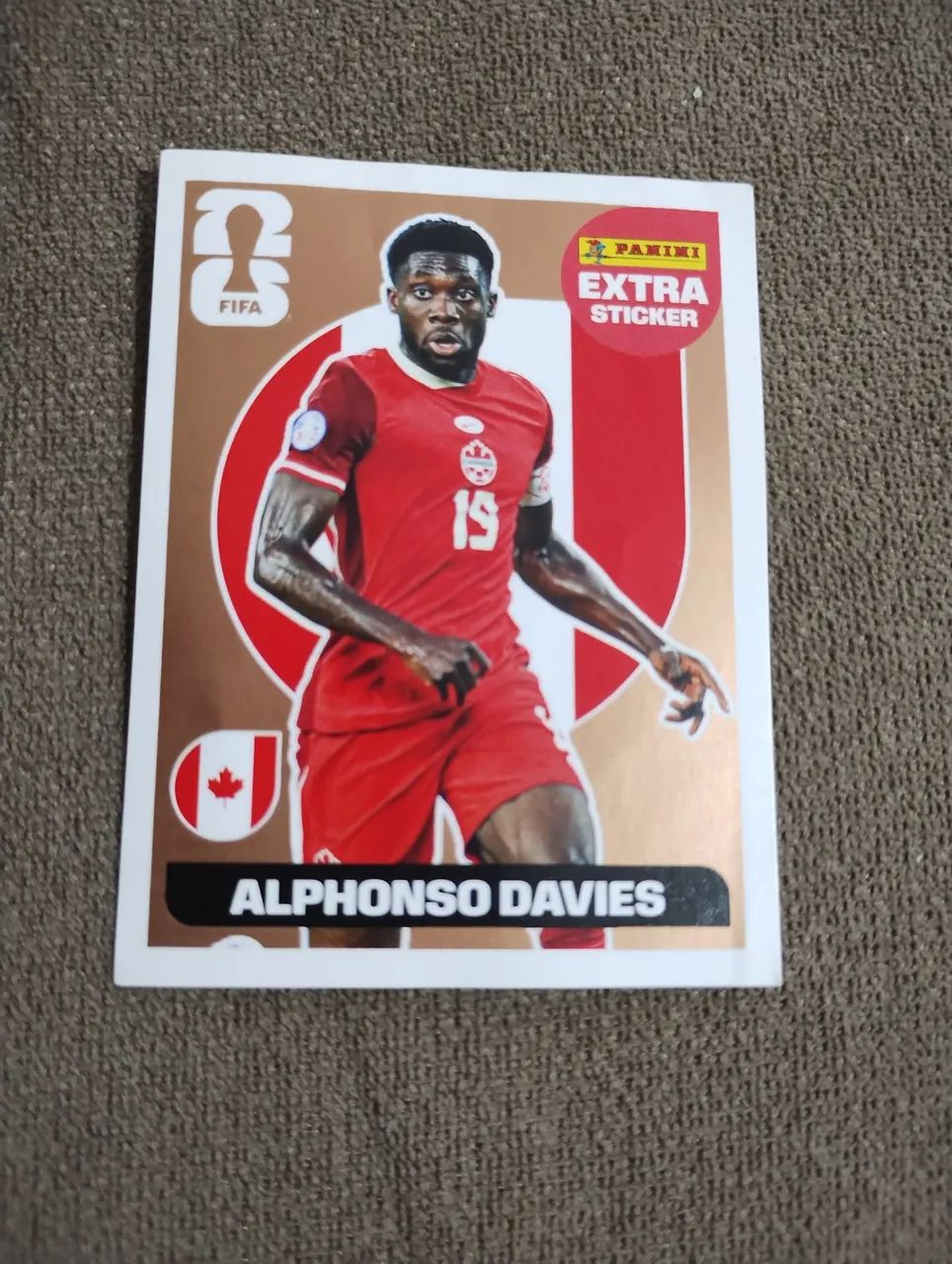 Figurinha extra sticker bronze Alphonso Davies