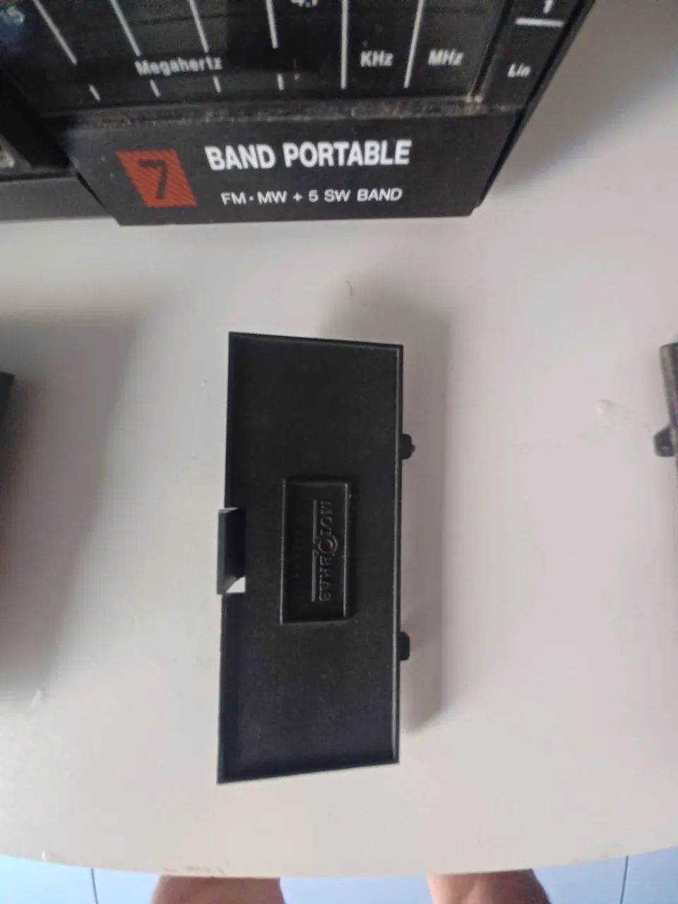 Tampa de pilha motoradio motobras