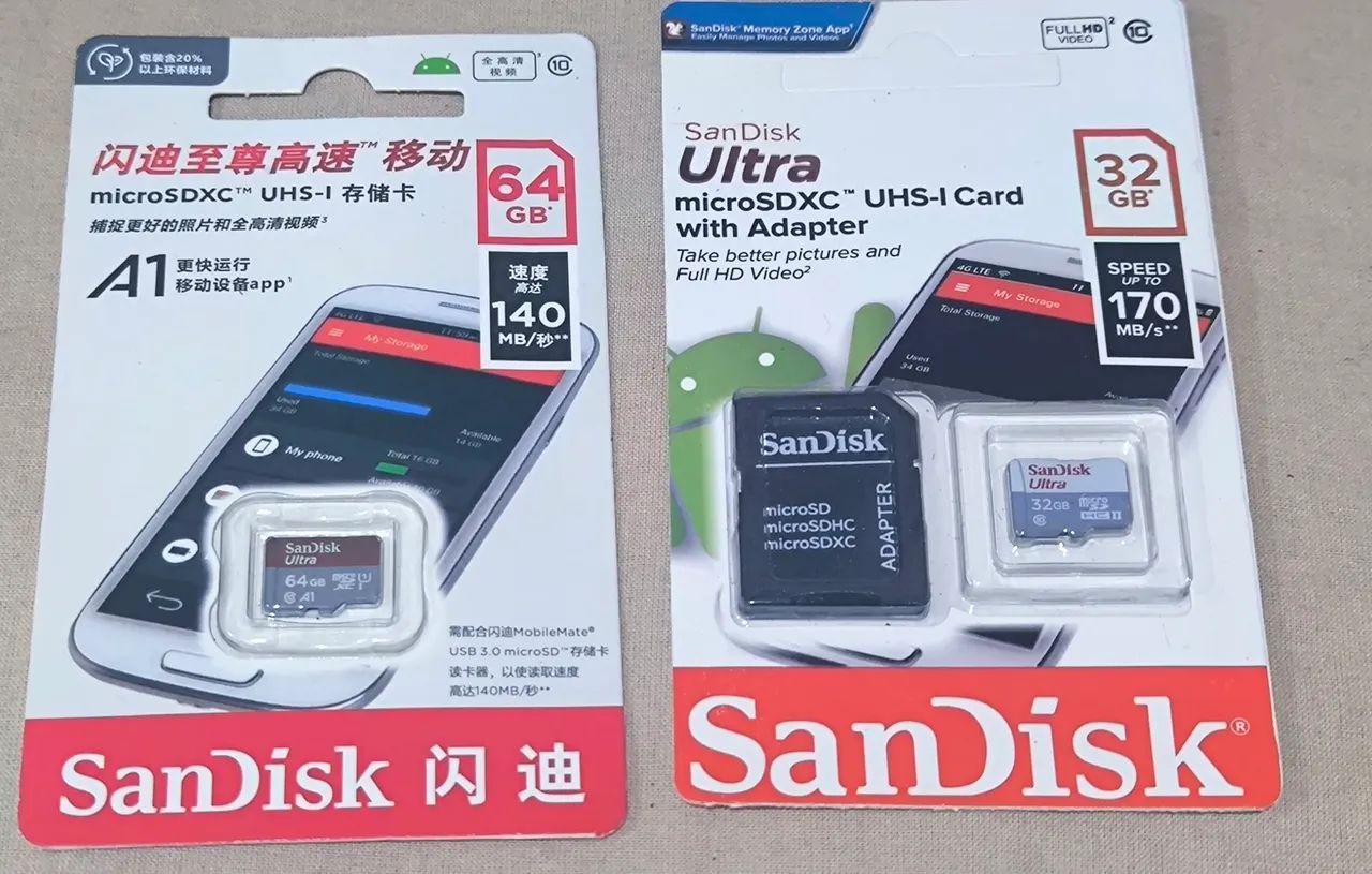 Cartão de Memória Sandisk Ultra 64GB microSDXC UHS-I e outro de 32 gigas.