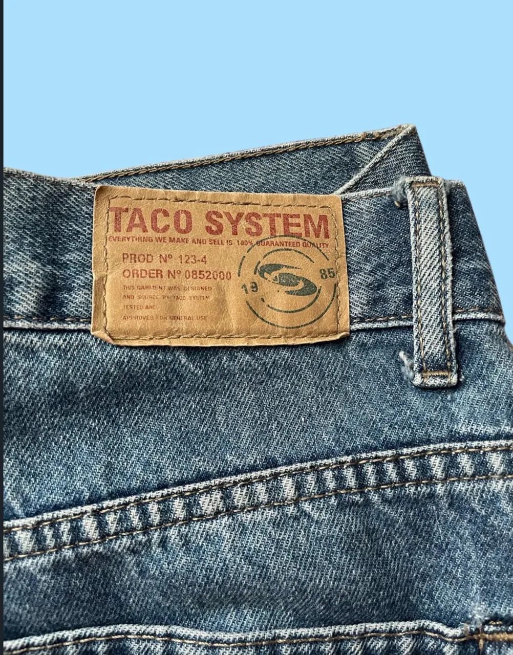 calça jeans taco modelagem reta