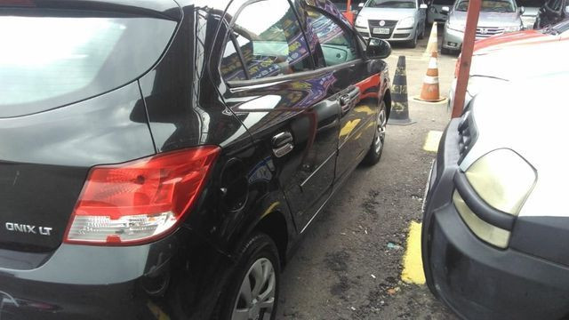 Vendo Onix LT 1.0 2013 - Completo * Entrada + 36x R$ 699,00 * C/ GNV - Foto 6