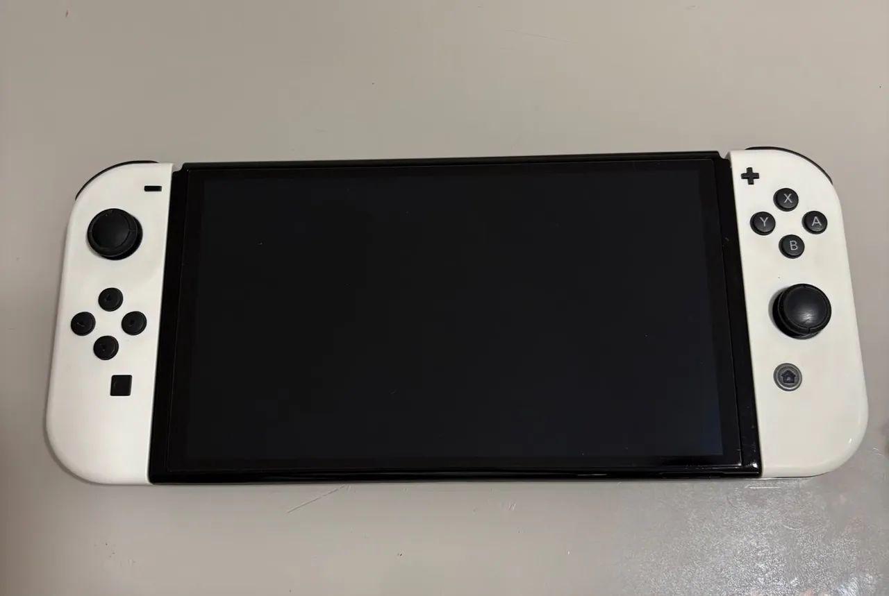 ? Nintendo Switch OLED Branco + 2 Jogos + Maleta - Foto 2