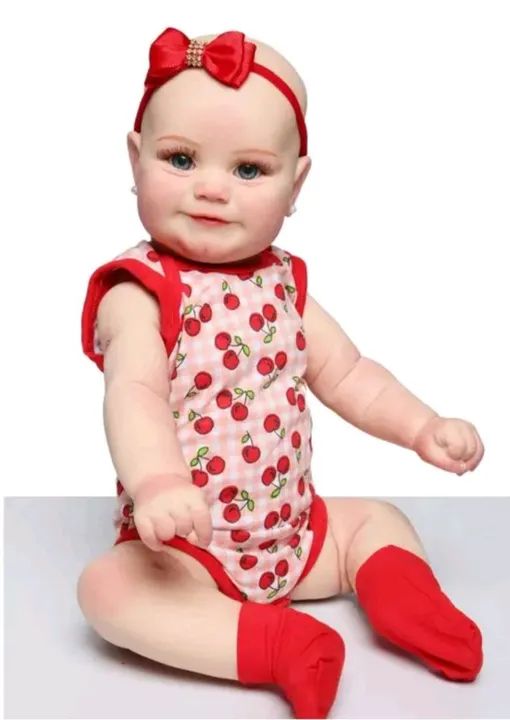 Boneca Reborn Nova 55cm 1.5 kg com acessórios  - Foto 4