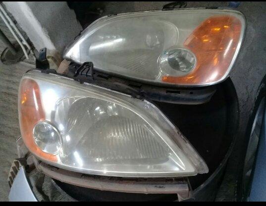 Par de farol original Civic 2003