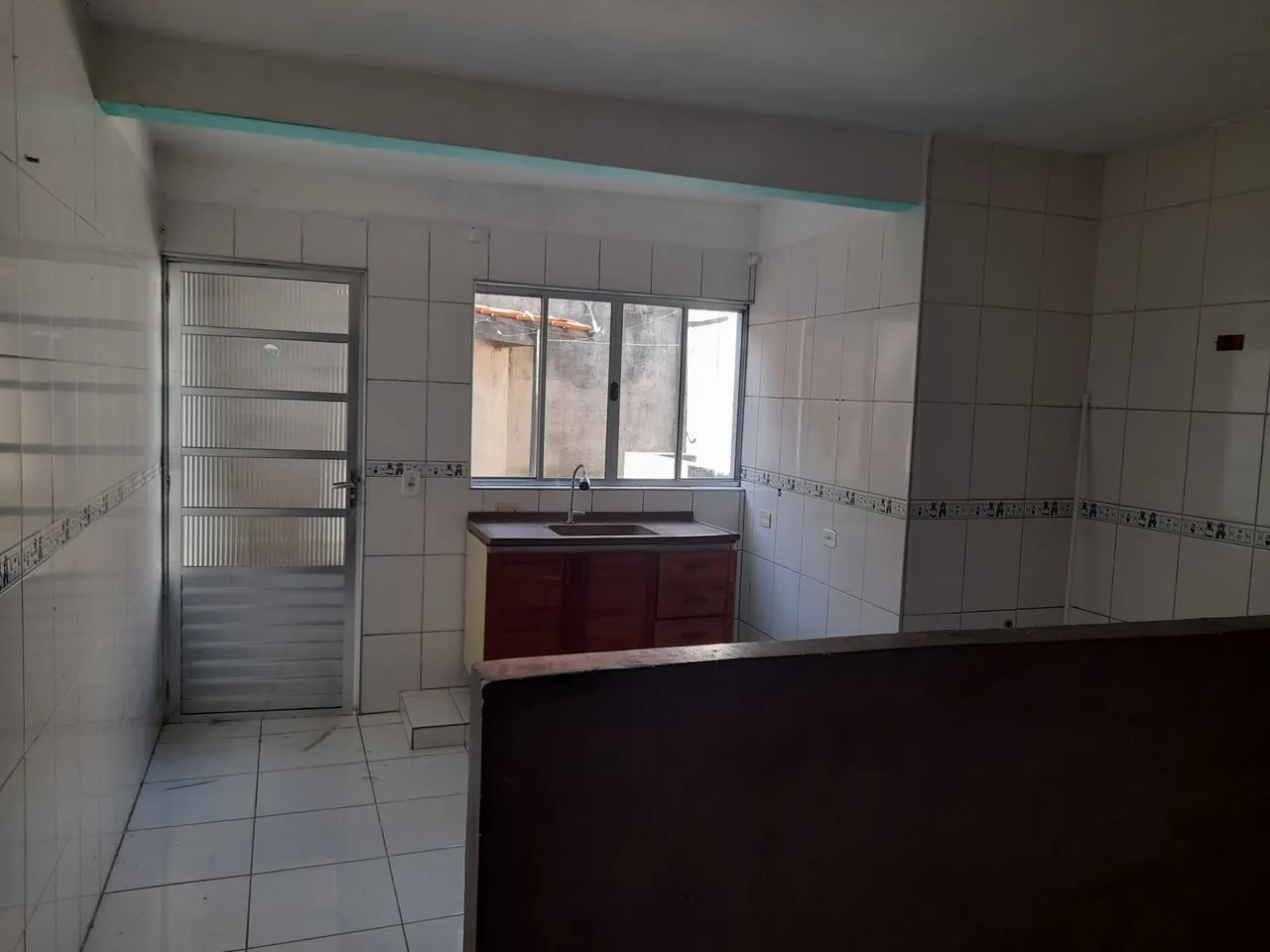 Quarto e cozinha americana