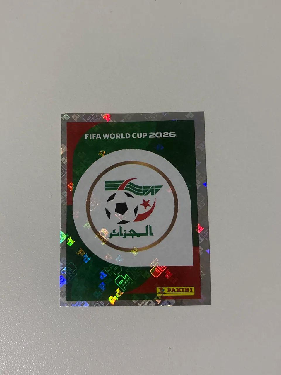 Figurinha da Copa 2026 Escudo da Argélia Versão Rara Prateado