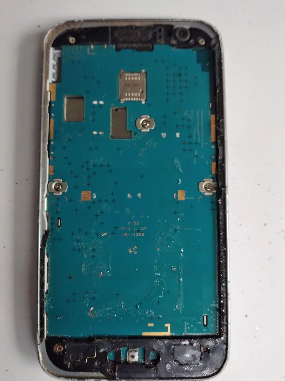 Placa ea carcaça com bateria do celular Samsung j120H está funcionando 