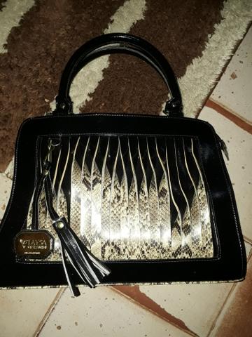 Bolsa de couro nova nunca usada.custou 158.vendo 100