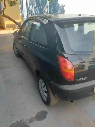 Celta preto com doc atrasado 02 anos