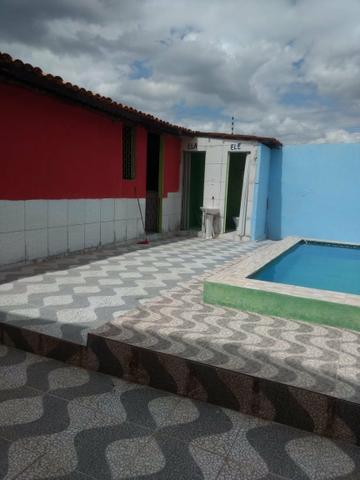 Vendo 4 casa , sendo uma com piscina e salão de festa com ponto de comércio.