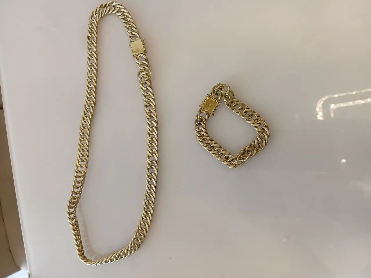 Corrente e pulseira de moeda antiga 
