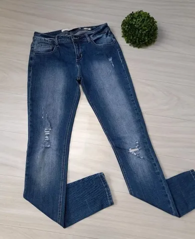 Calça jeans feminina skinny, cintura alta, elastano, bolsos e zíper. <br>