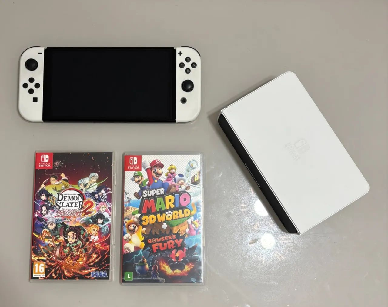 ? Nintendo Switch OLED Branco + 2 Jogos + Maleta - Foto 4