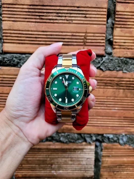 Relógio de luxo dourado e prata um clássico de elegância  e sofirticação aceitamos cartão 