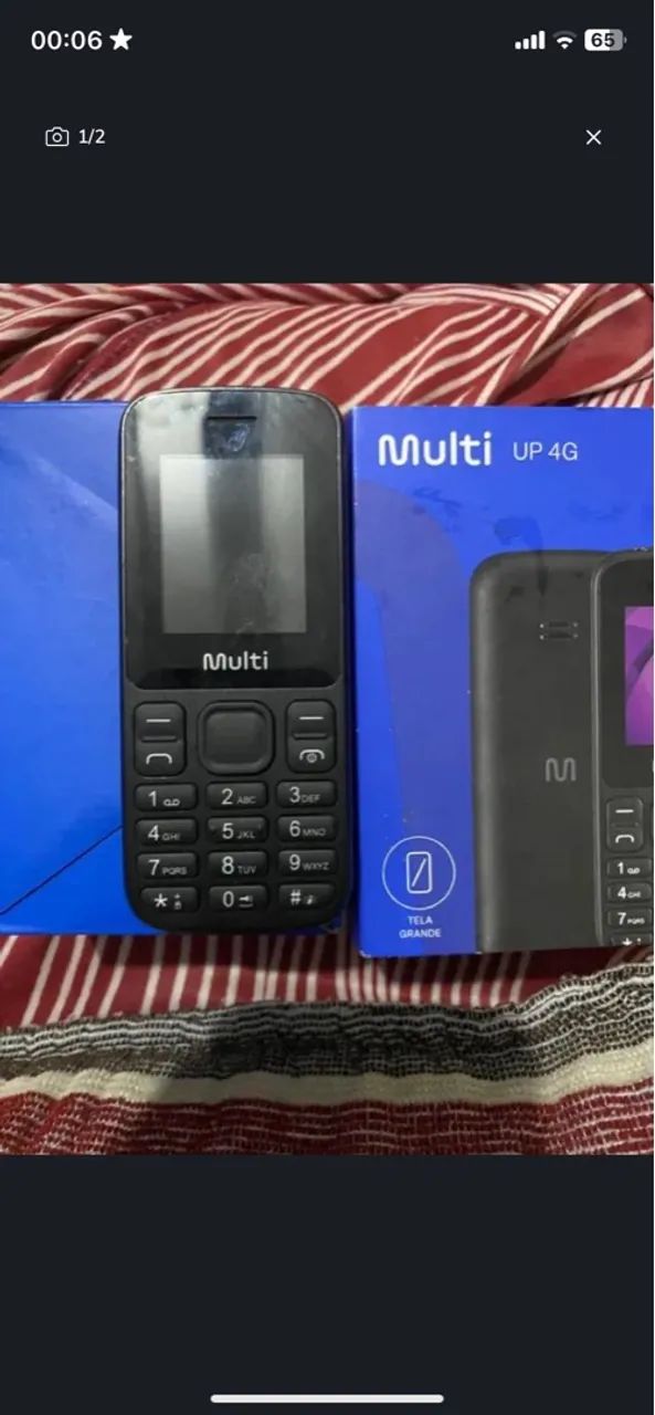 Celular multi de botão na caixa 